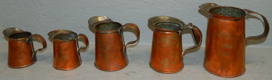 5 early copper pitchers. (1 of 1)