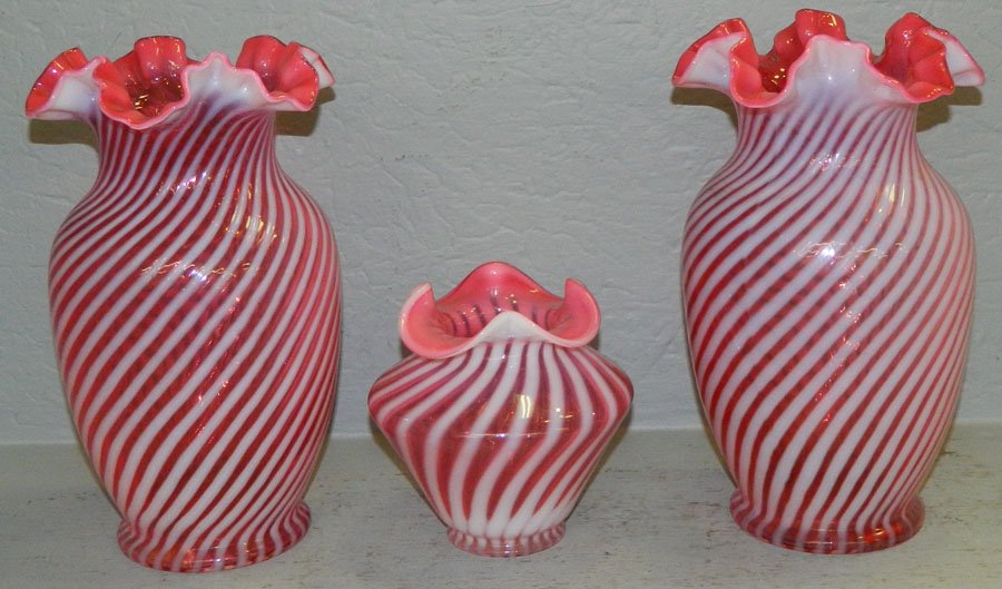 3 cranberry swirl vases. (1 of 4)