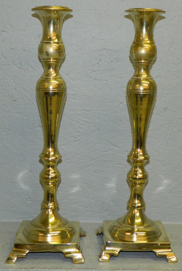 Large pair of footed cast brass candlesticks. (1 of 2)