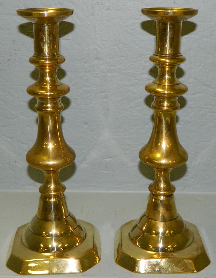 Pair of early brass push up candlesticks (1 of 2)