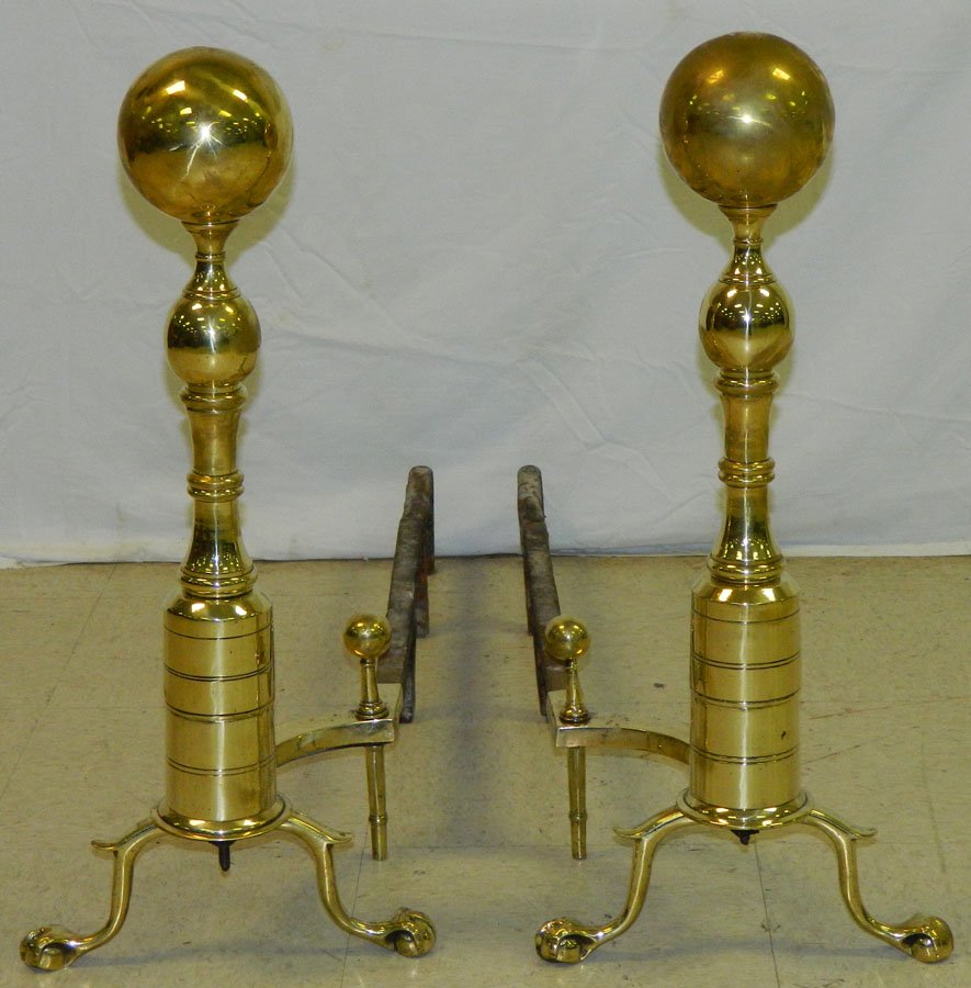 Pair of cannonball claw foot andirons: Pair of cannonball claw foot andirons. 25" tall