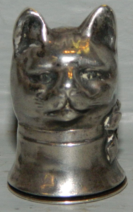 English sterling cat's head shaped pill box: English sterling cat's head shaped pill box. 1 1/2" tall.