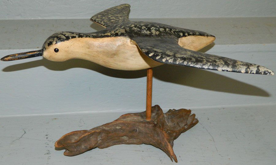 Carved and painted shore bird on driftwood base (1 of 1)