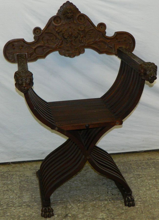 Scissor chair with carved lion head arms. (1 of 4)