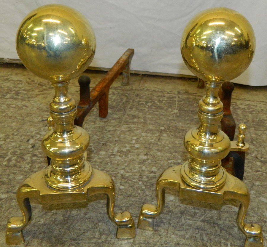 Pair of cannonball brass polished andirons: Pair of cannonball brass polished andirons 67" tall.