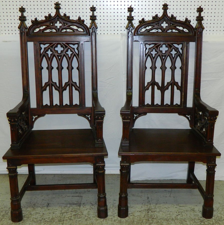 Pair of carved Gothic mahogany arm chairs: Pair of carved Gothic mahogany arm chairs. 53 1/4" tall.