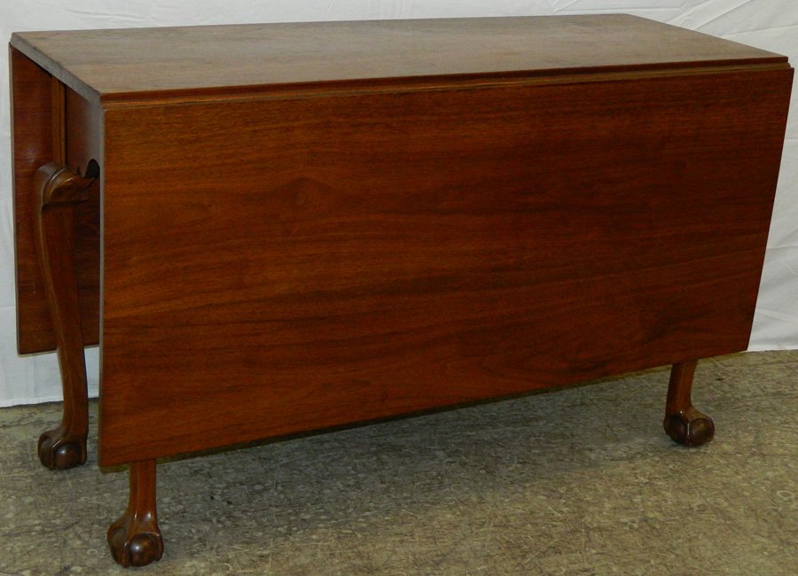 Walnut Chippendale ball and claw drop leaf table.: Walnut Chippendale ball and claw drop leaf table. 56 1/2" open x 45 1/2" wide x 27 1/2" tall.