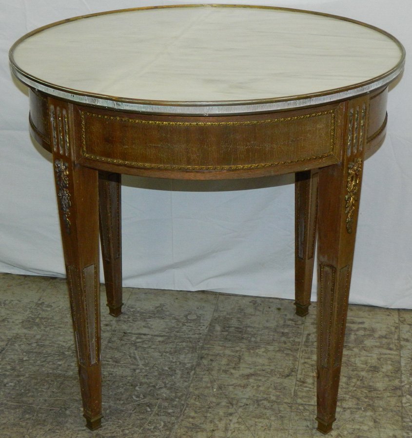 Round French marble top table w/ ormolu mounts: Round French marble top table with ormolu mounts. 30 1/2" dia. X 29 1/2" tall.