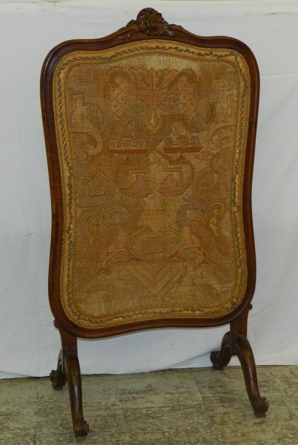 French carved needlepoint fire screen.: French carved needlepoint fire screen. 42 1/2" tall.