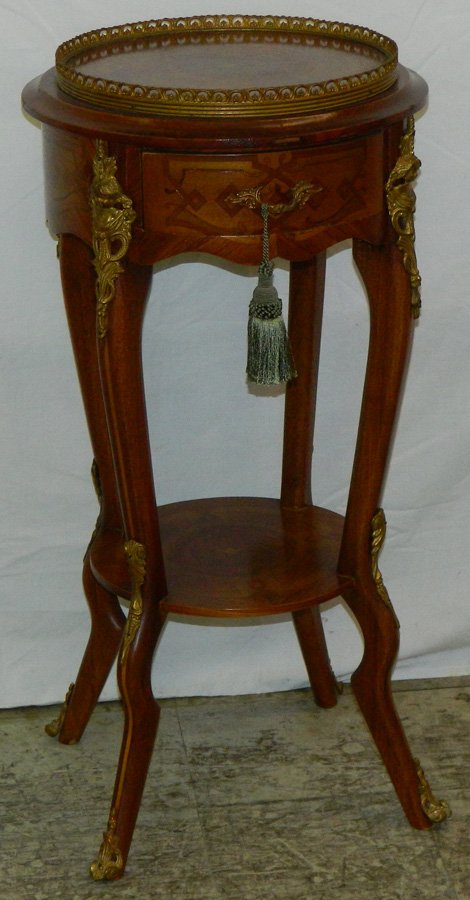 French inlaid stand with ormolu mounts.: French inlaid stand with ormolu mounts. 13" dia. X 31" tall.