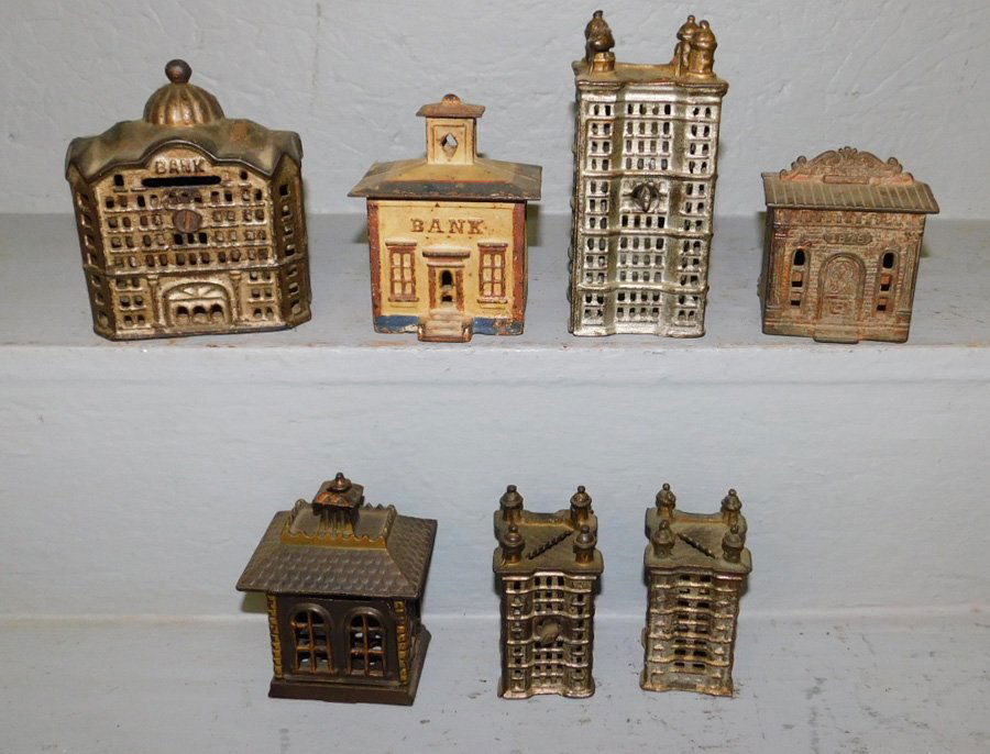 7 antique cast iron banks. To 5 3/4" tall. (1 of 1)