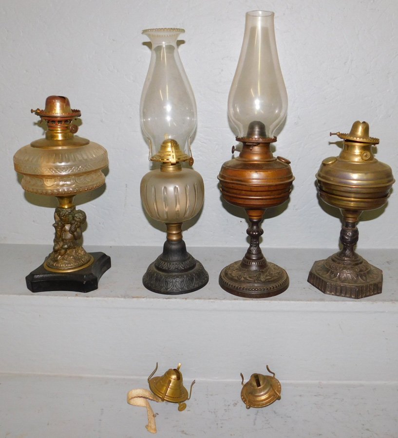 4 early font and 2 brass lamps w/ cast iron bases. (1 of 1)