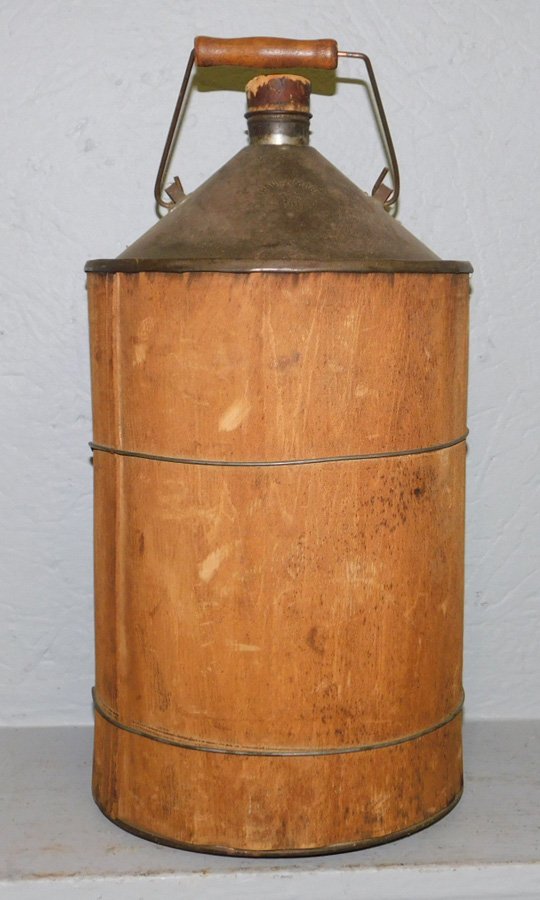 Early wood and tin oil can. 17" tall. (1 of 1)