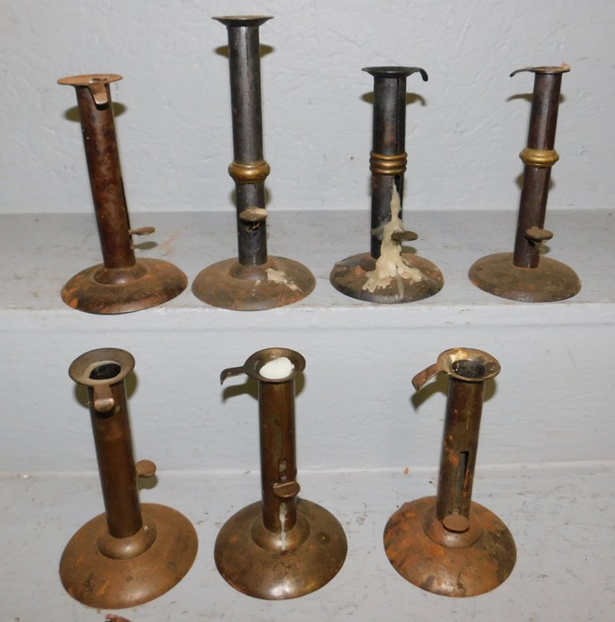7 antique hog scraper candlesticks. To 8 1/4" tall. (1 of 1)