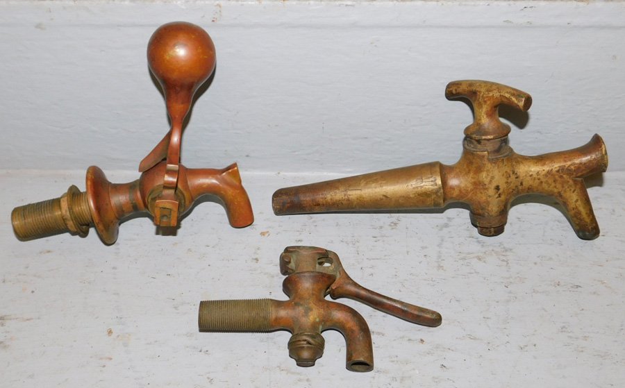 3 early brass wine and beer taps. To 9" long.: 3 early brass wine and beer taps. To 9" long.