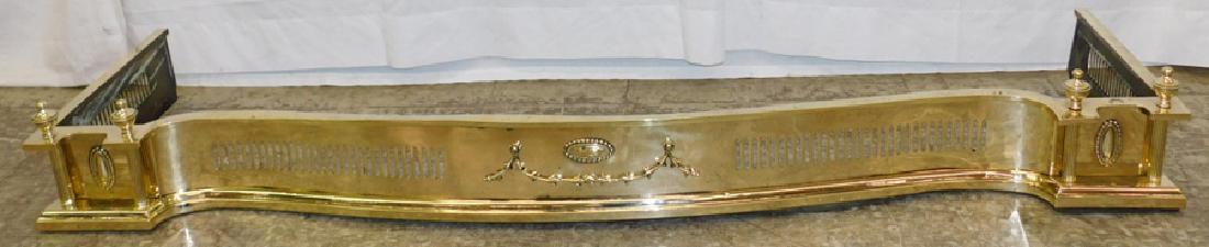 Serpentine shaped polished brass fire fender. (1 of 3)