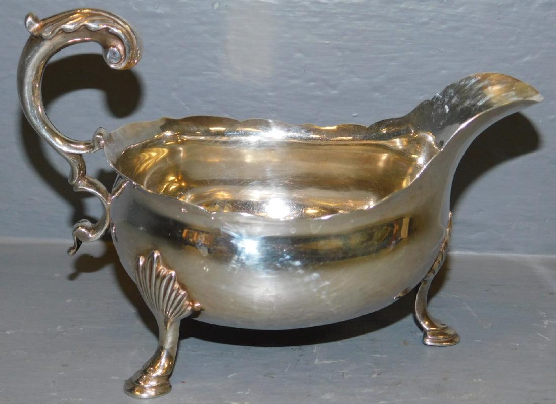 Sterling sauceboat by George Smith, London 1764.: George III sterling sauceboat by George Smith, London 1764. 6 1/2" long.