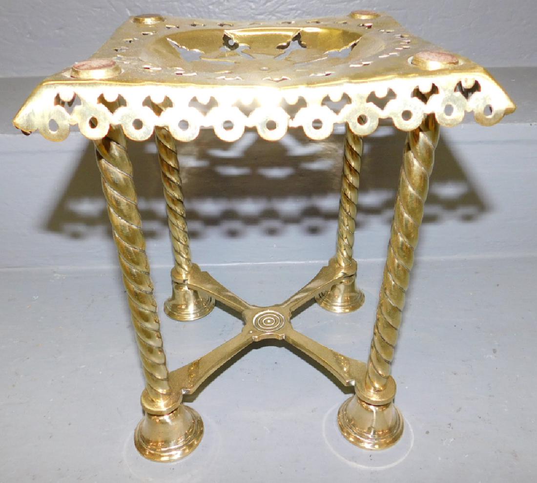 Early brass trivet. 8" square x 10" tall. (1 of 2)