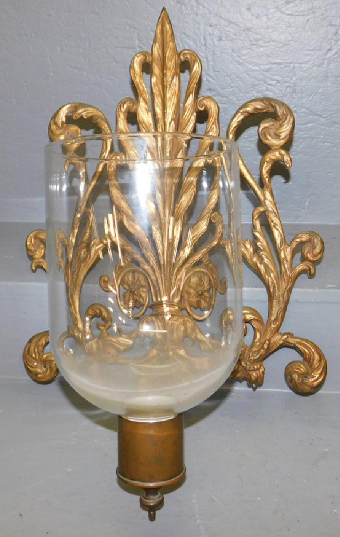 Brass fleur de lis style wall sconce with shade. (1 of 2)