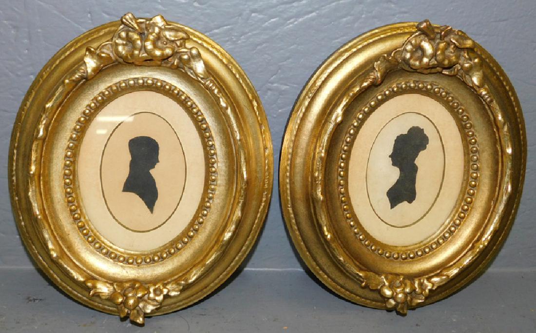 2 gold framed silhouettes. 8" x 9". (1 of 2)