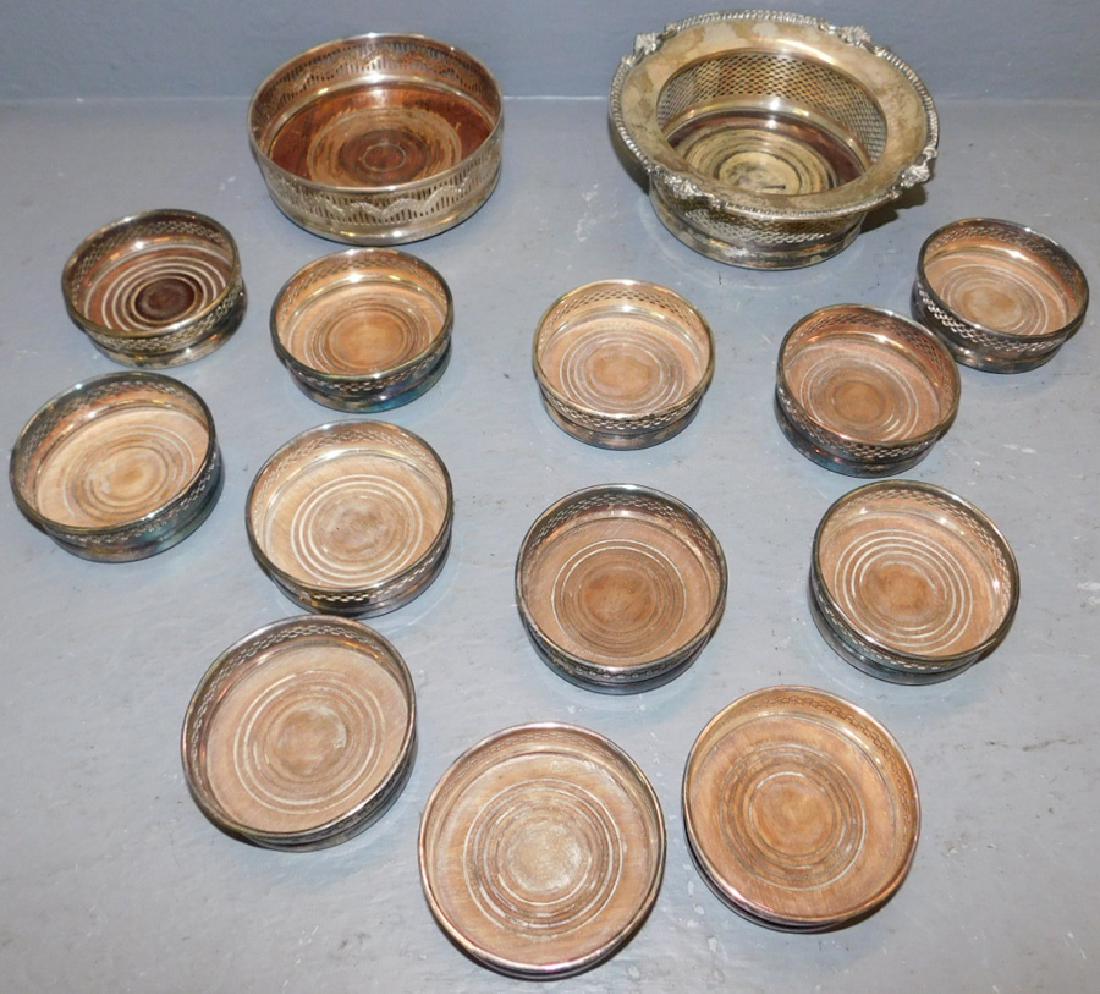 14 assorted silver plate wine coasters.: 14 assorted silver plate coasters. To 7 1/4" dia.