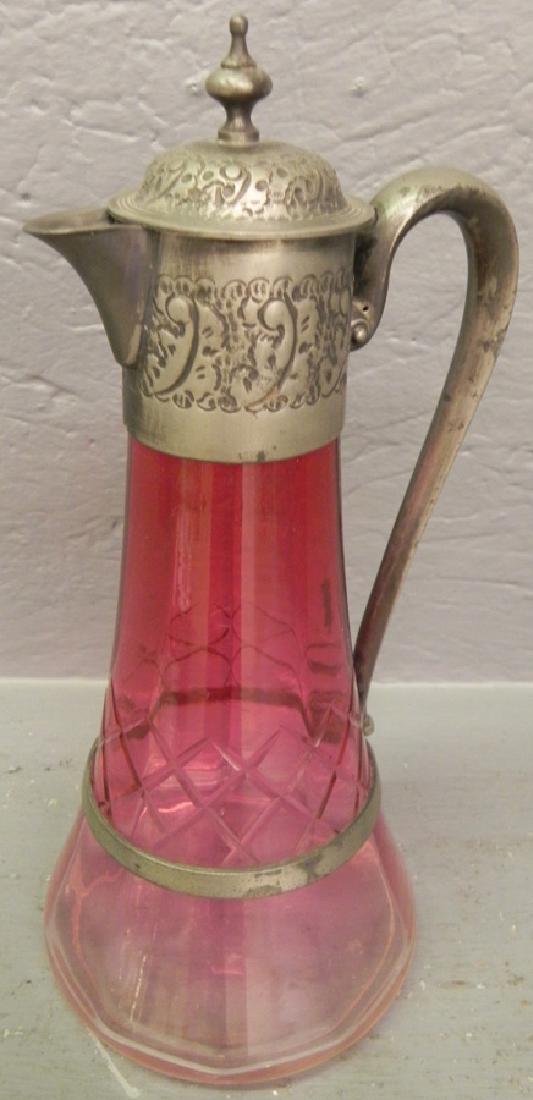 Cut to clear cranberry pitcher w silver plate handle. (1 of 2)