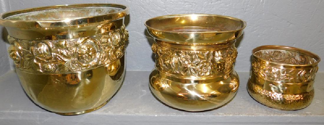 3 polished brass jardinieres. To 10" tall.: 3 polished brass jardinieres. To 10" tall.