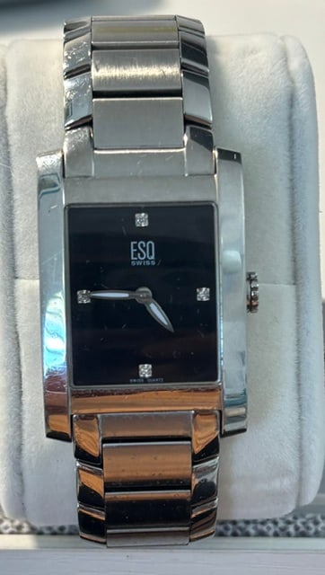 ESQ Swiss Watch by Mavado: Beautiful solid steel case and band with black face. Four genuine diamond hour markers has its original operating instructions27mm model E5297