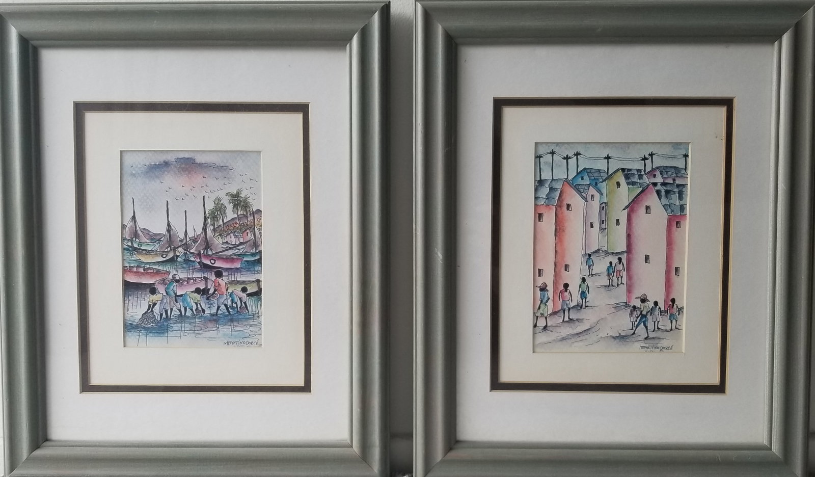 Village Scenes: Charming pair of framed watercolor paintings by Martino Dorce on paper; identical measurements on both, depicting lively coastal and village scenes rendered in the artist’s distinctive