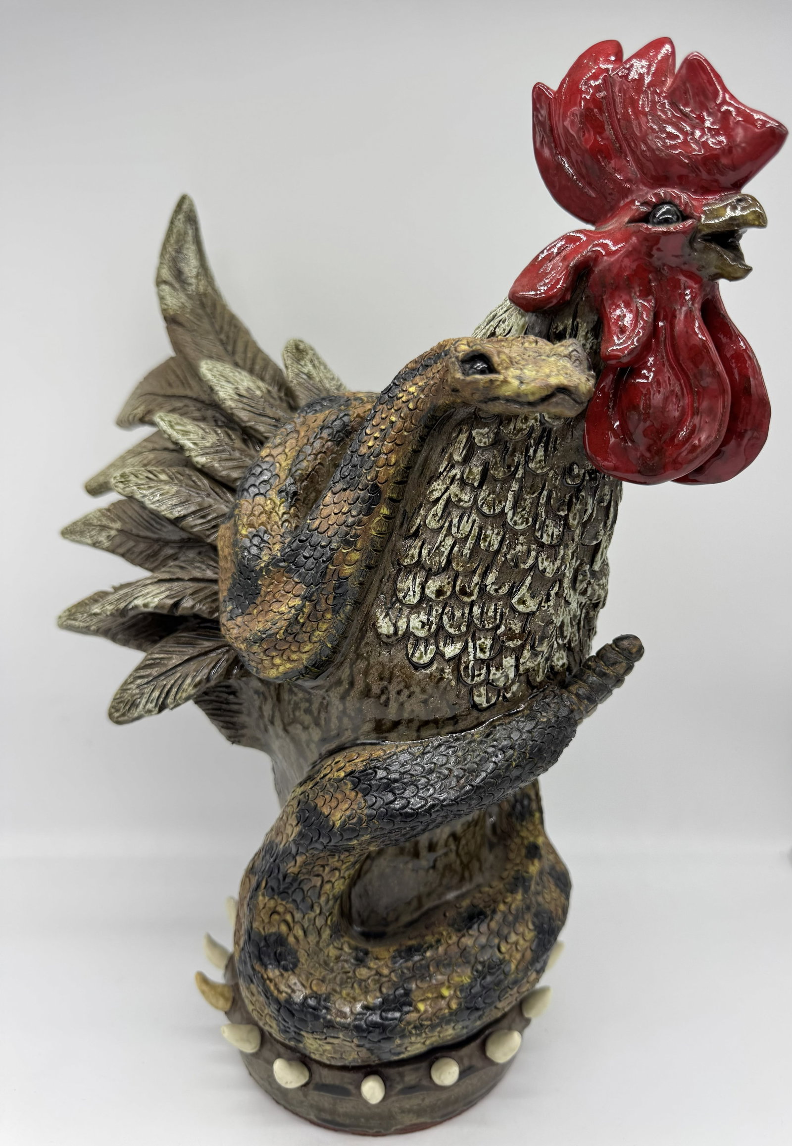 Dwayne Crocker Rooster with Snake: A beautiful rooster and snake figural piece by Dwayne Crocker, showcasing a great interaction between the two forms. The rooster features a deep red glazed comb with white and black feathering, while