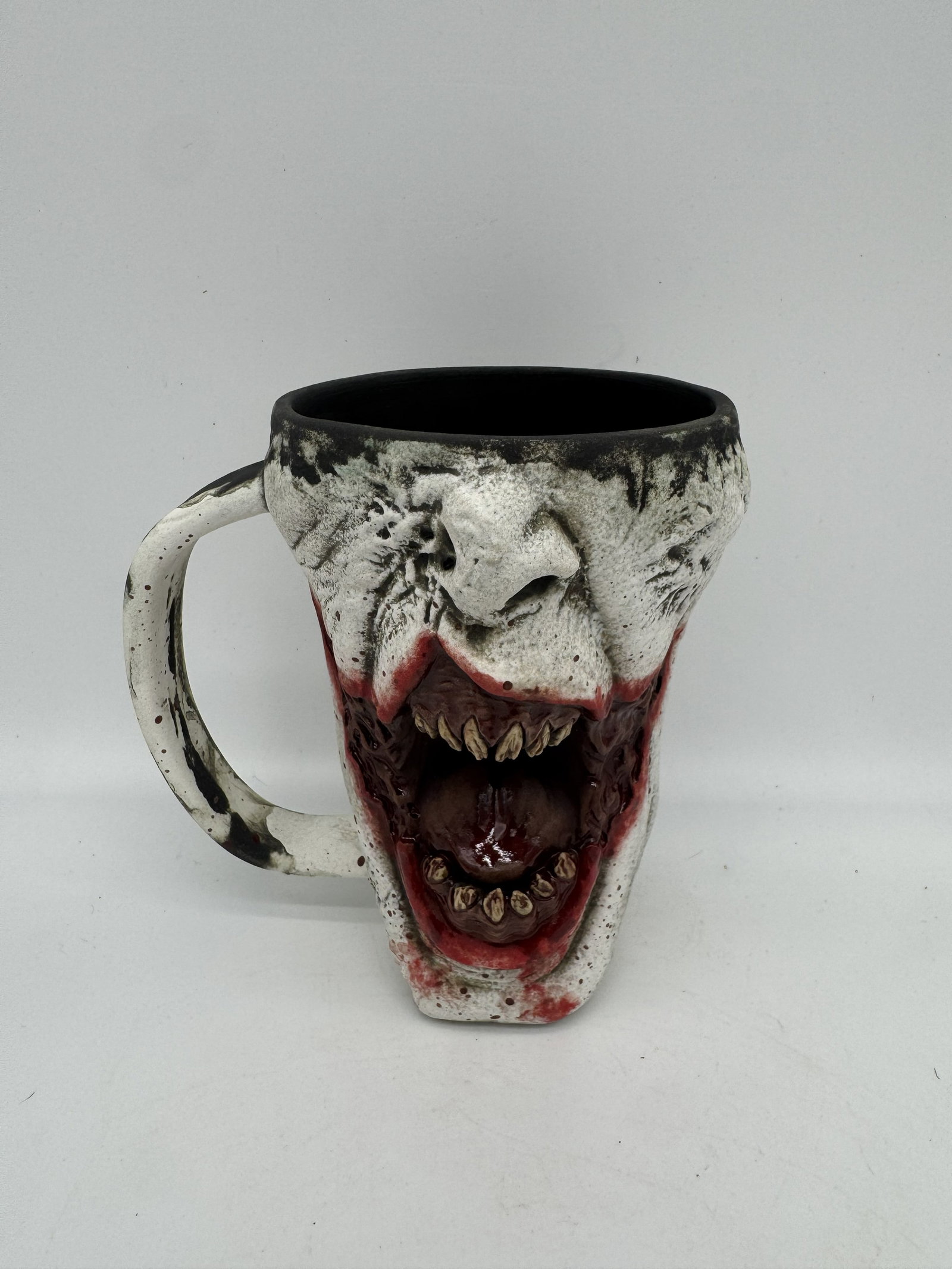 Turkey Merck Arkham Syd Mug: An “Arkham Syd” mug by Turkey Merck, representing a style produced in limited numbers. Only 30 produced making this one very desirable. This example shows strong detail and craftsmanship