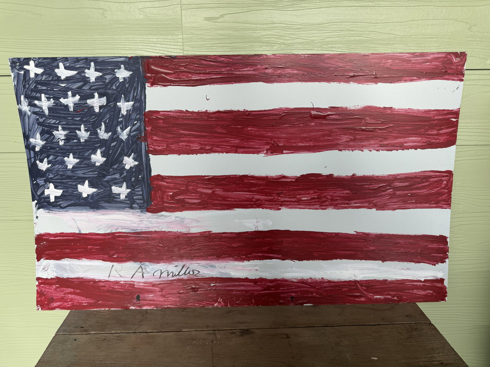 Large RA Miller American Flag Painting: A large painting by R.A. Miller, depicting an American flag rendered in strong, vibrant colors. The consignor purchased this directly from RA while the paint was still wet.