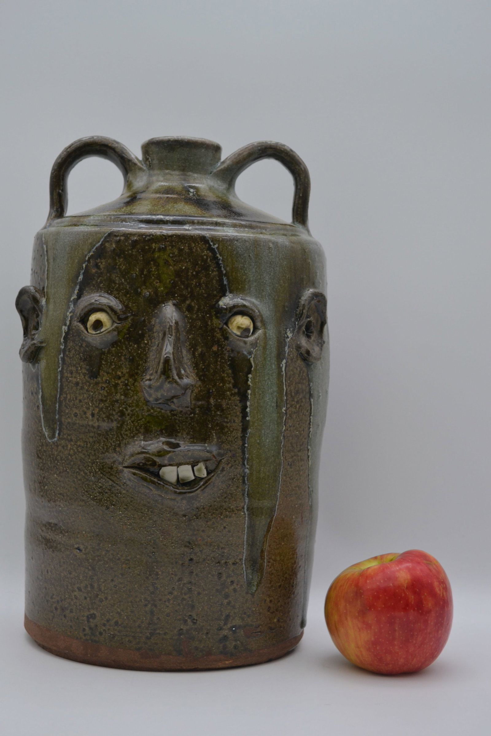 David Meaders Double Face Stacker Jug: A large double-face stacker face jug by David Meaders. Wood-fired in David’s own kiln, this impressive jug features two distinct faces, each with its own unique expression and personality. The contr