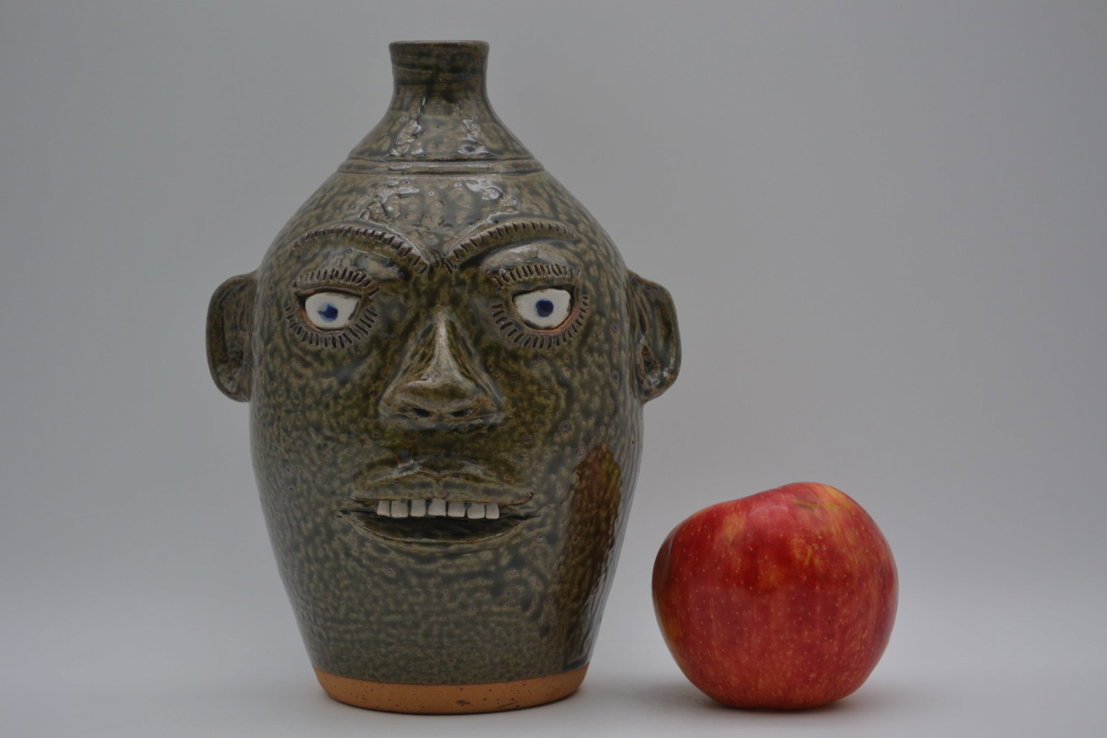 A.G. Meaders Face Jug: An A.G. Meaders face jug, made circa 1991. A.G. had a relatively short pottery career, and it is believed that he produced 200 or fewer face jugs in total, making any face vessel by him exceptionally 