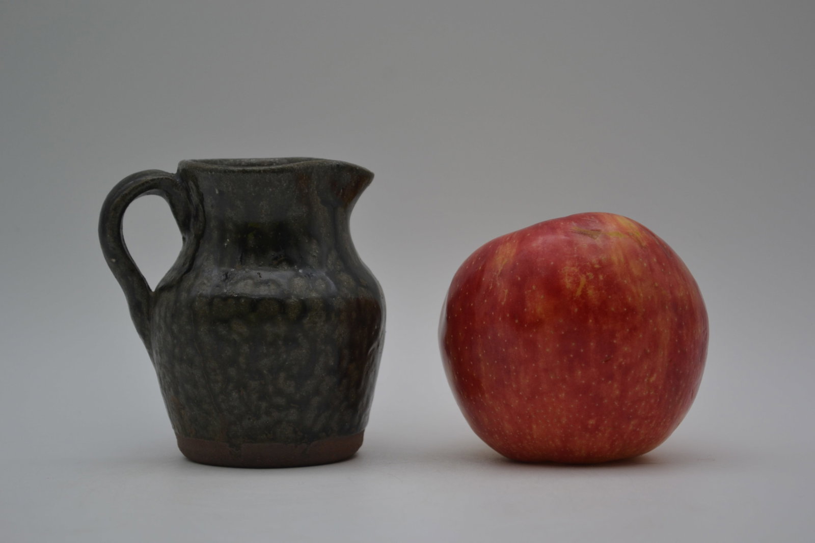 A.G. Meaders Small Pitcher: A small pitcher by A.G. Meaders, dated 1990. Measuring only a few inches tall, this charming smaller form is a fine example of A.G.’s utilitarian pottery and showcases his craftsmanship on a