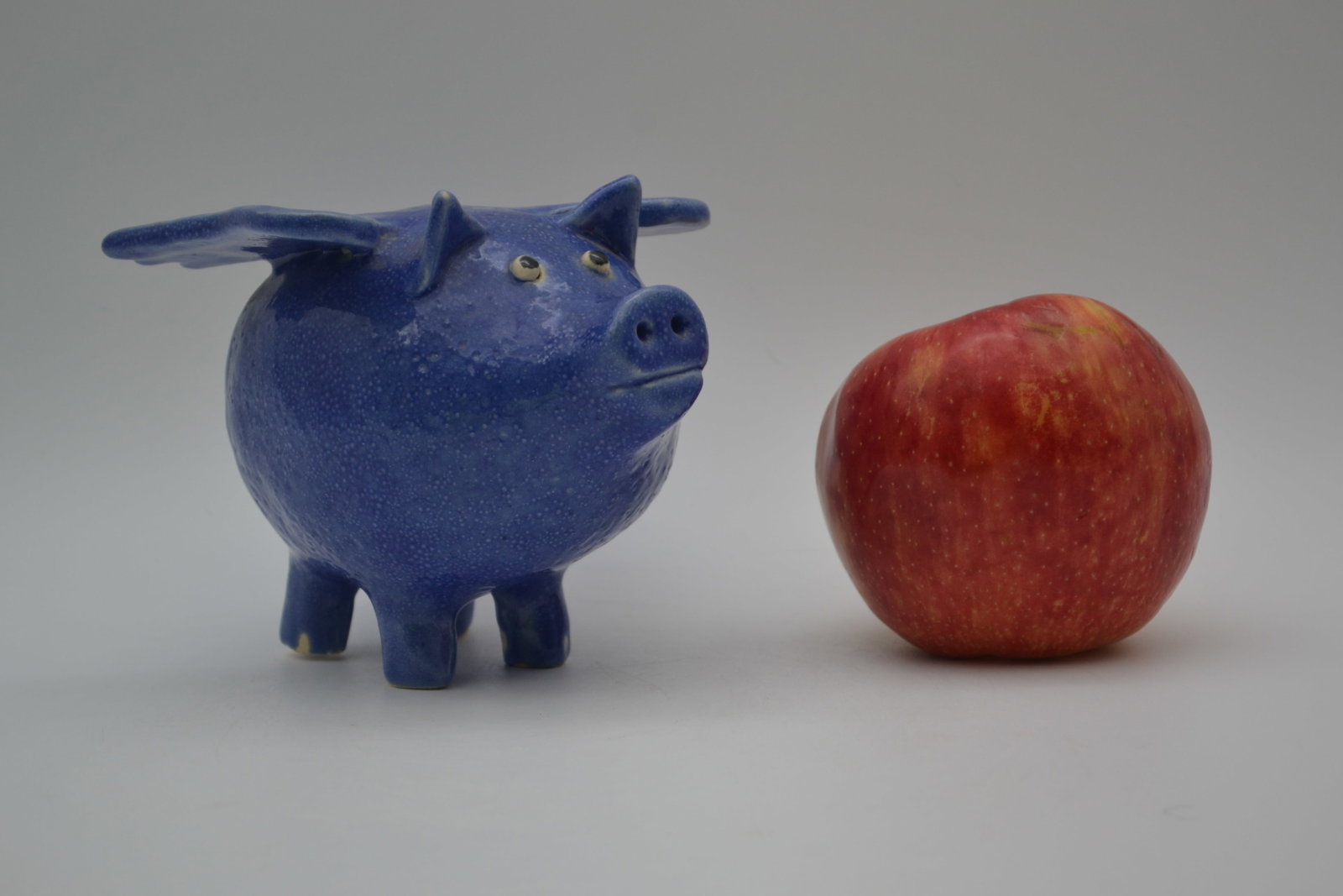 Ruby Meaders Angel Pig Figural: A Ruby Meaders angel pig figural. This is an exceptionally rare and imaginative form by Ruby, with only two examples believed to have been made. Finished in a beautiful cobalt glaze, this highly