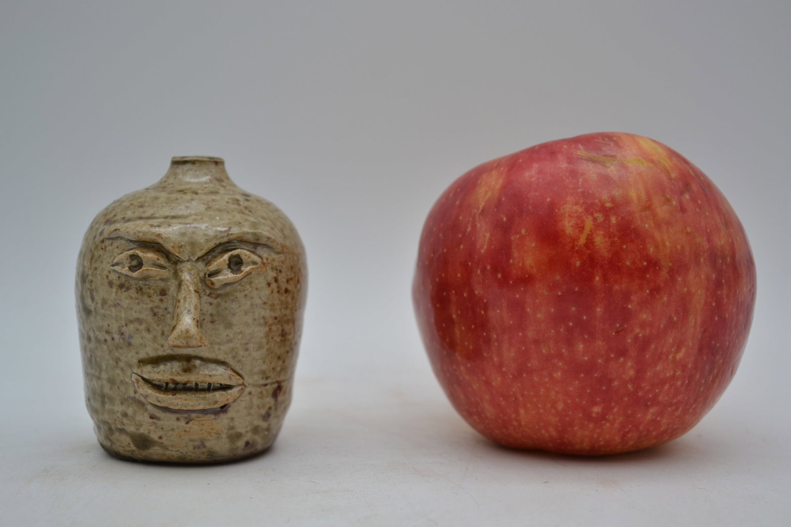 Possible 19th-Century Texas Pottery Face Jug: A possible 19th-century face jug. This fascinating new discovery was found buried in an old showcase in an antique store in Arkansas. Standing just three inches tall, this remarkable face jug is belie