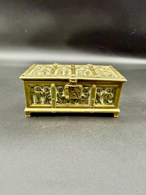 19th Century Gothic Revival Jewelry Casket or Relic Box: This brass 19th century gothic revival jewelry casket / relic box features detailed panels depicting medieval religious or biblical scenes under Gothic arches.Used as a decorative box for jewelry and
