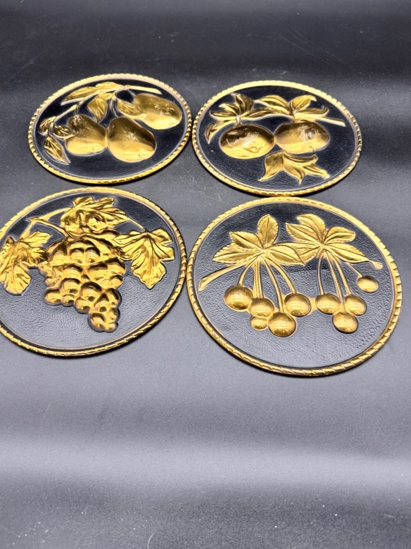 Elpec England fruit wall hanging plaques (set of 4): Set of 4 vintage Elpec England embossed brass wall hangings featuring various fruit designs on a hammered textured black background. Manufactured by Elpec in England. Mid Century decor.
