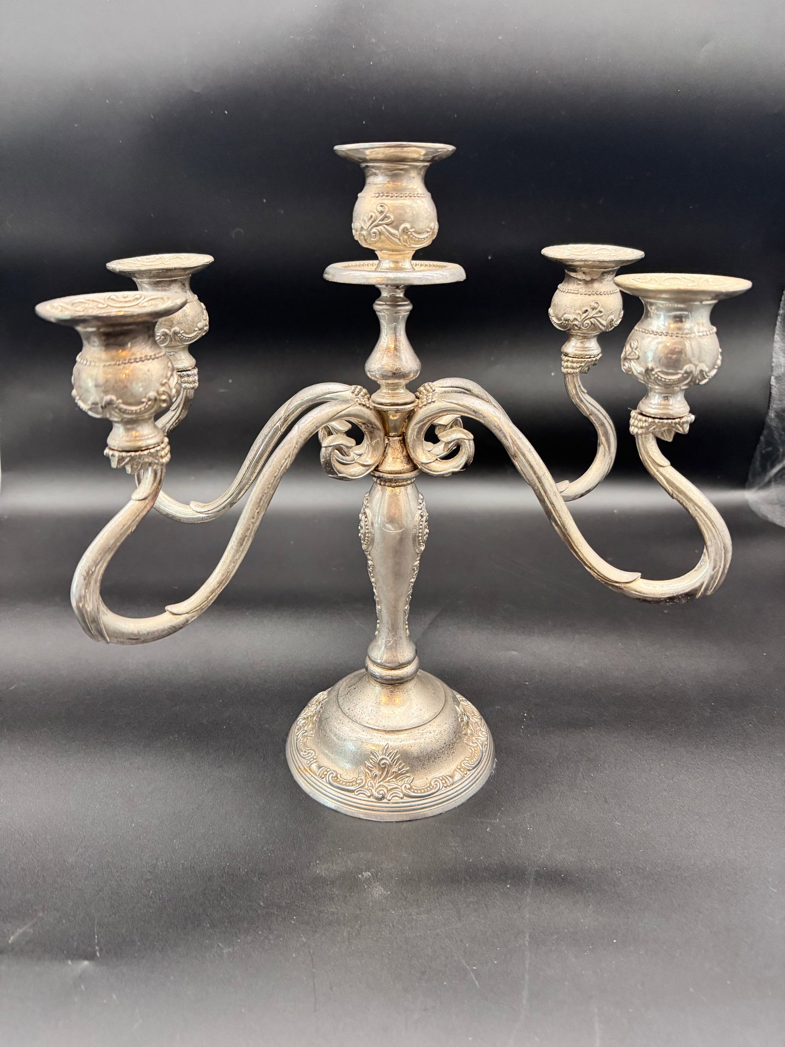 Vintage GSA (Godinger Silver Art) 5-Light Candelabra, Victorian Style Floral Scroll Detail: This is a unique vintage GSA (Godinger Silver Art) 5-light candelabra, crafted with intricate Victorian-Style floral or scroll details. Made of an ornate silver-plated core, this is a heavy and
