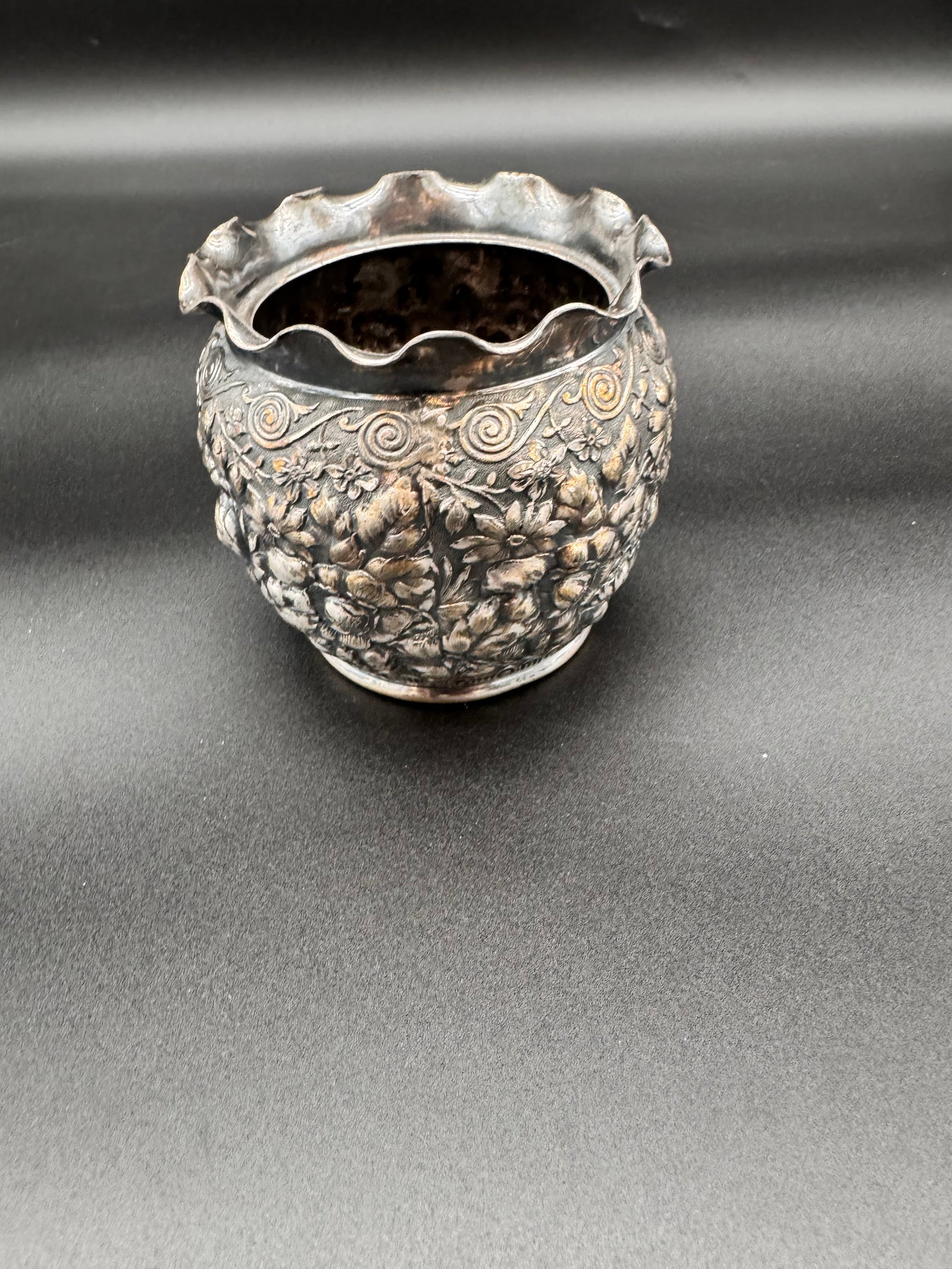 Reed & Barton Silver Plated Bowl: This is a stunning piece with a repoussé floral design. Small vase shape with a ruffled or scalloped top edge.