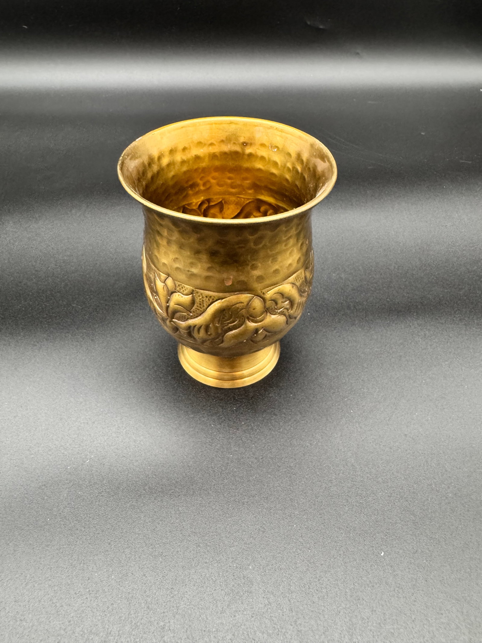 Brass Tankard/Cup with Hammered Texture on Top: Mid Century Brass tankard/cup. Ebossed and etched body with floral foliage motif. Hammered texture on top.