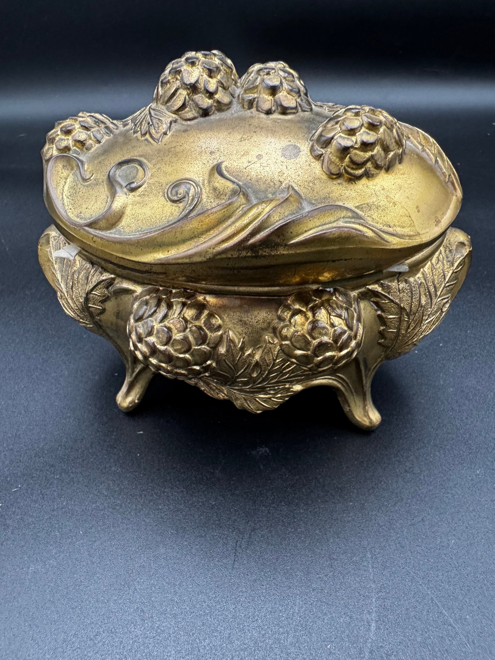 Victorian Art Nouveau Jewelry Casket: Marked on the bottom with 96 stamp, these Victorian Art Nouveau Jewelry Casket were manufactured between 1895 and 1920. The box is constructed from spelter with gilded or matte gold finish featuring a