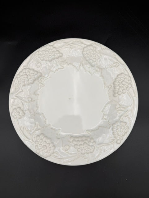 White Bordallo Pinneiro Plate: White ceramic dinner plate featuring a sculpted grapevine design, made in Portugal. One plate