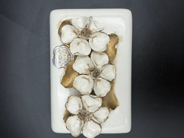Vanity Trinket Box Featuring Raised White Dogwood Flowers: Lovely vintage vanity trinket box featuring delicate raised white dogwood flowers with gold leaves. The box is aged, but lovely. I would suggest lightly tracing under each flower with a qtip to