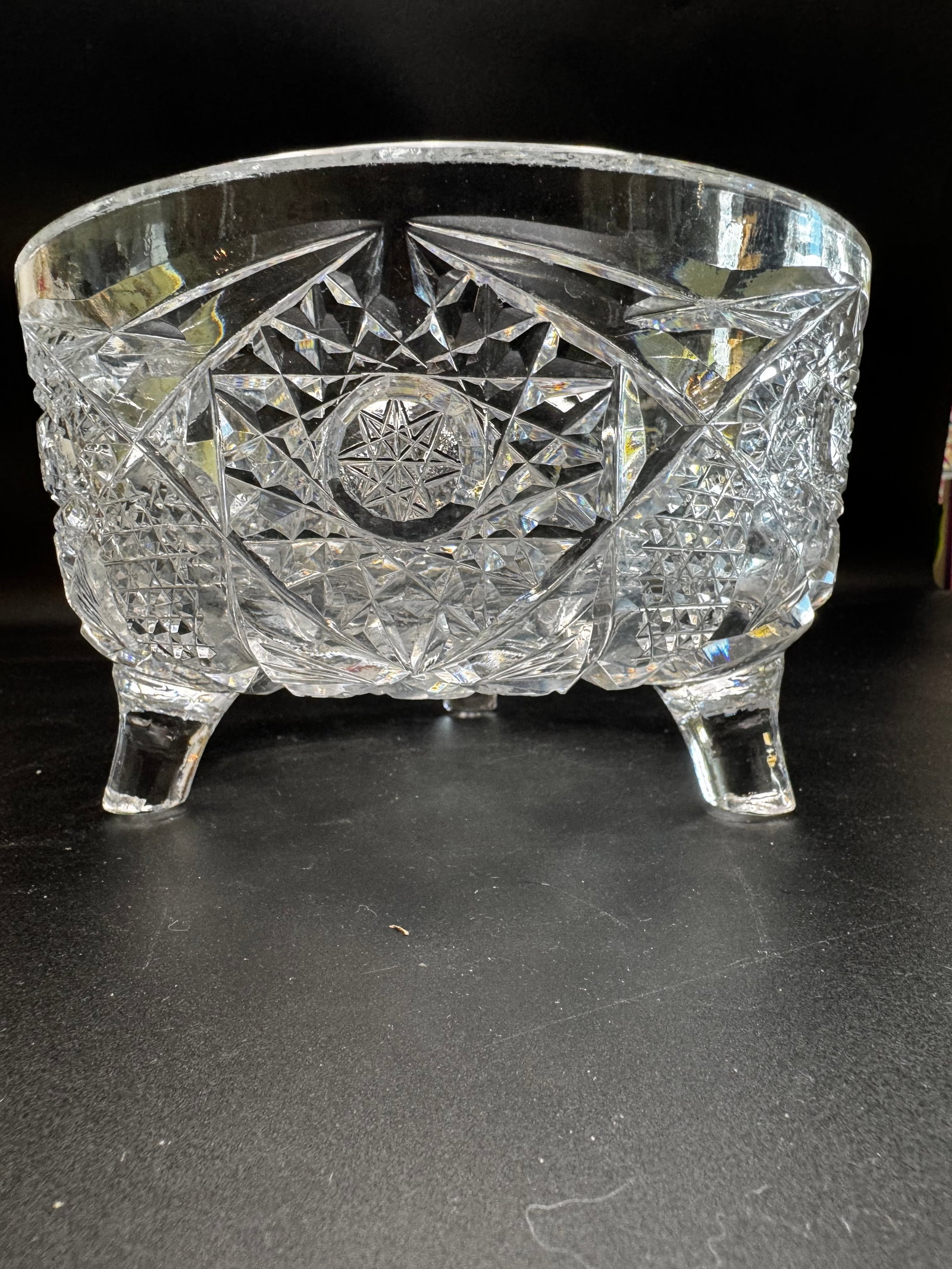 Vintage Cut Glass Three Footed Bowl: This beautiful bowl with geometric patterns is likely from the Byrdes Collection made in Germany