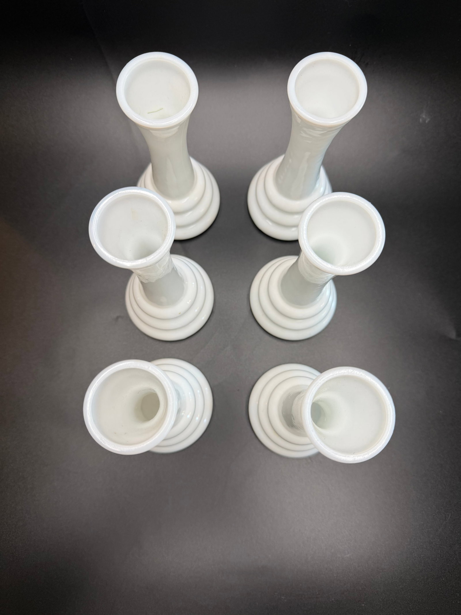 Mid Century Modern Randall Milk Glass Bud Vases: The vases feature a glossy finish with a signature beehive-style ribbed base and a slimmer, flared top. Produced in the United States, they are classic examples of mid-century modern style Set of 6