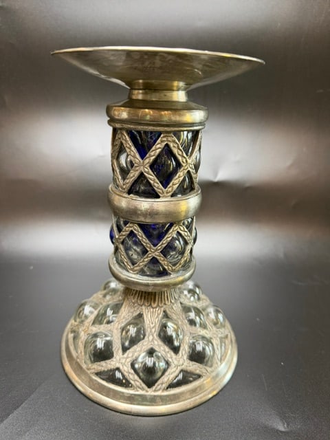 Vintage Hand-Blown Cobalt Blue Caged Glass and Metal Pillar Candle Holder.: The glass is blown directly into a metal framework, causing it to expand and protrude through the decorative openings. These decorative pieces were popular exports from Italy during the Mid Century Mo
