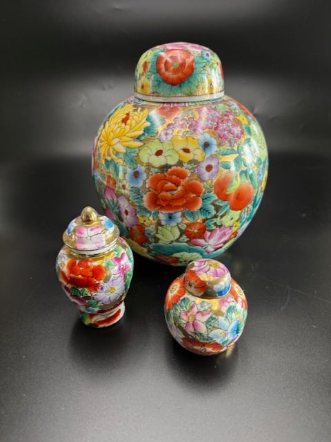 Vintage Chinese Porcelain Ginger Jars: The "millefleur" pattern, or thousand flowers design, traditionally represents a blessing of abundance and includes various blossoms like peonies and chrysanthemums. These are ceramic or porcelain