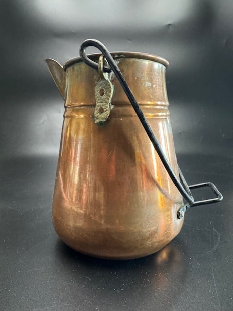 Vintage Rustic Copper Hearth / Camp Kettle: This is a vintage rustic copper pitcher/hearth/ camp kettle with a distressed finish and a metal handle. Hand formed copper body with tapered shape. Rived or attached iron bail handle for hanging.